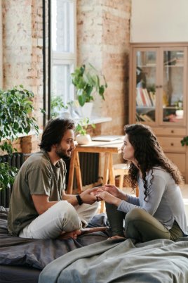 A Couple Sitting on the Bed while Having Conversation, art of communication in relationships
