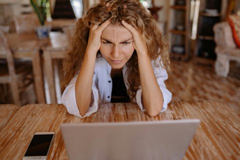 Photo of Woman Leaning on Wooden Table While Looking Upset, mental masturbation