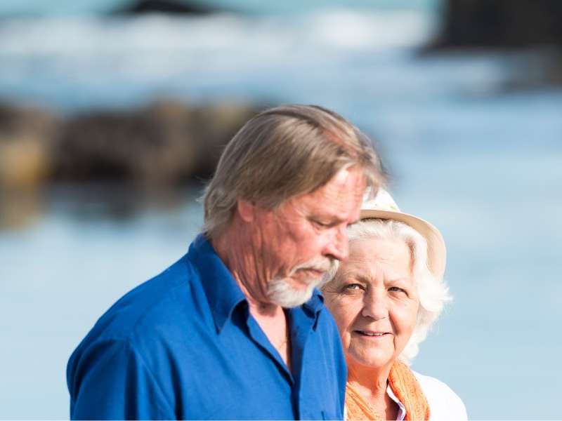 Couple having a walk alone in the beach having conversation